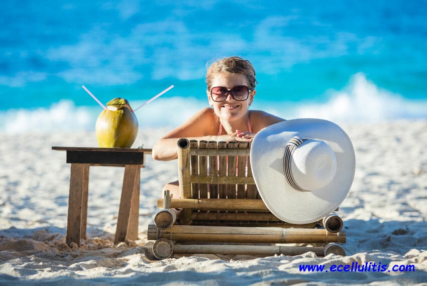 skin health tips for summer - woman with coconut cocktail - Why does my skin peel?